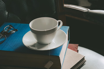 Book and tea on the desk with study
