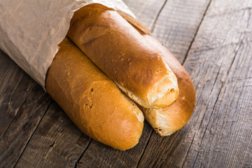 Baguette bread on wooden table