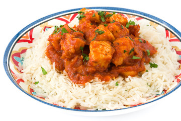 Chicken tikka masala with basmati rice isolated on white background