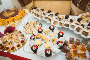 Different kinds of baked sweets on a buffet