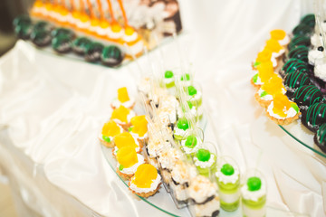 Different kinds of baked sweets on a buffet