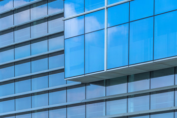 Clouds Reflected in Windows of Modern Office Building..