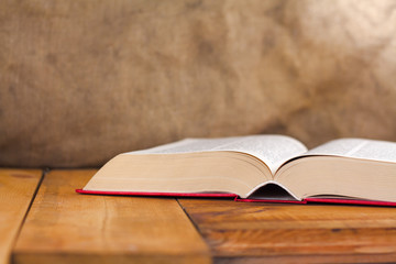 open book on wooden table