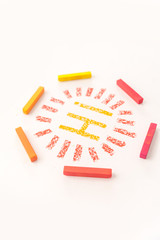 Close up photo of word HI inside a frame made of bright and colorful pastel chalks