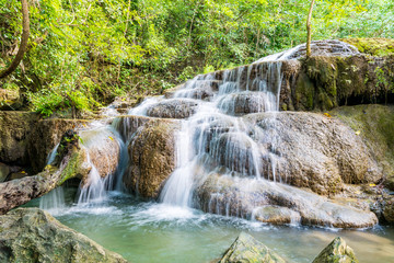 Fototapeta na wymiar Beautiful tropical waterfall in forest, Erawan waterfall