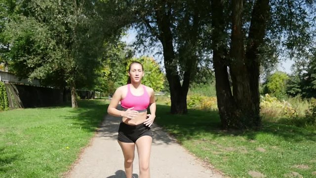 Beautiful young woman run in nature, slow motion