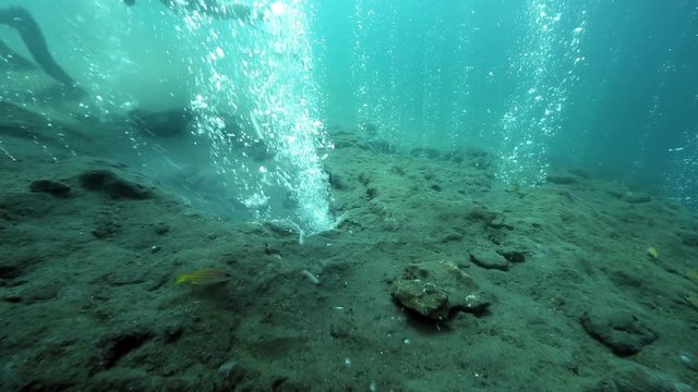 Scuba diving among hot bubbles from underwater volcano, Pulau Weh, Aceh, Indonesia 