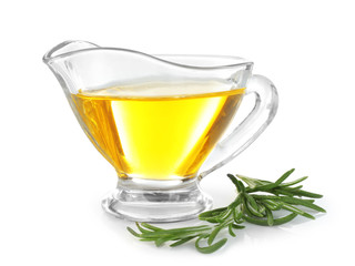 Gravy boat with rosemary oil and herb on white background