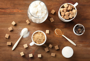 Various kinds of sugar on wooden table