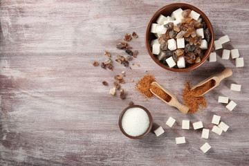 Various kinds of sugar on wooden table