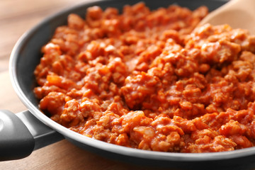 Fototapeta na wymiar Meat sauce in frying pan, closeup