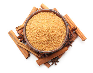Composition with cinnamon sugar and sticks on white background