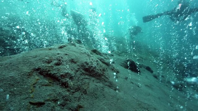 Scuba diving among hot bubbles from underwater volcano, Pulau Weh, Aceh, Indonesia 