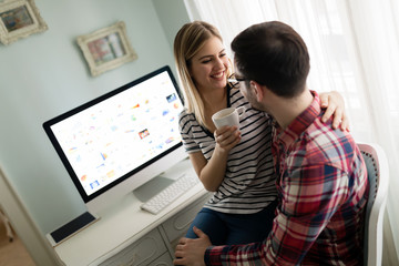 Young attractive designers working together from home