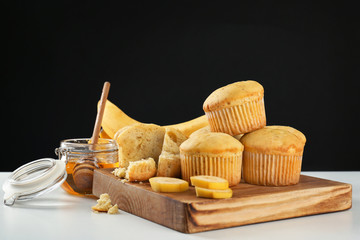 Obraz na płótnie Canvas Composition with banana muffins and honey on table