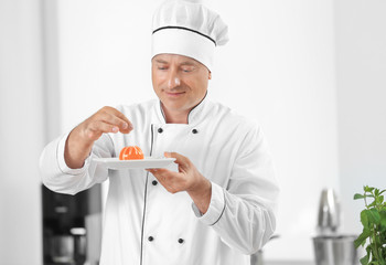 Male chef cooking dessert in kitchen