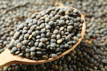 Spoon with healthy lentils, closeup