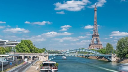 Eiffel tower at the river Seine timelapse from bridge in Paris, France