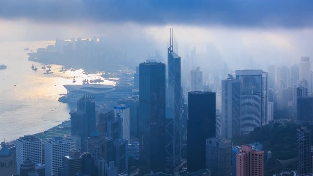 Aerial Silhouette Hong Kong Cityscape On Cloudy Day Over 4K Time Lapse (zoom out)