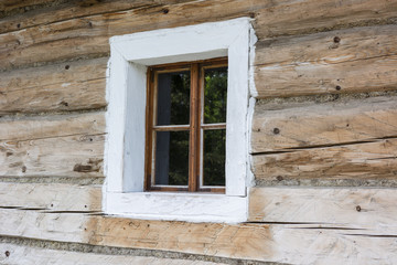 Window in side view of old wood.