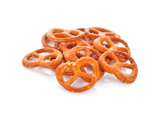 Salted pretzels on white background