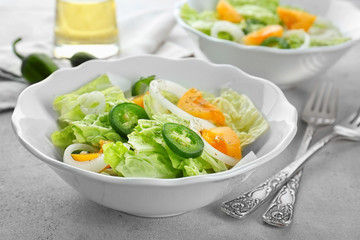 Delicious vegetable salad on table