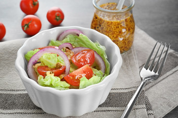 Delicious vegetable salad on table