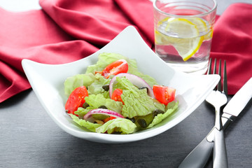 Delicious vegetable salad on table