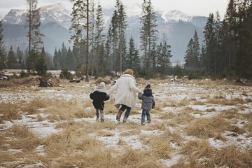 Mother with children walk in the mountain