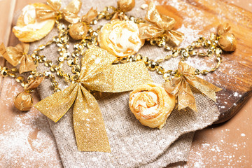 Gingerbread cookies hanging over wooden background.  christmas cookies