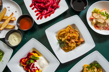 dishes with different food on the table. top view