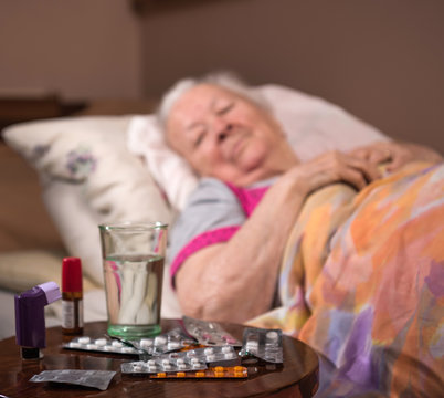  Sick Old Woman Lying In Bed At Home