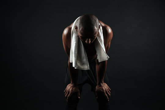 Young Afro American Sports Man Standing With White Towel, Resting After Workout