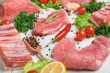Different types of meat on wooden table