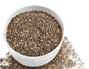 Bowl with chia seeds on white background