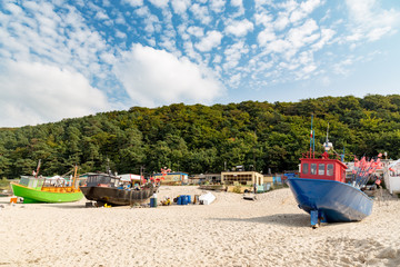 Three fishing trawlers on baltic beach