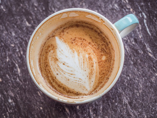 Top view and closeup of coffee cup and stain.