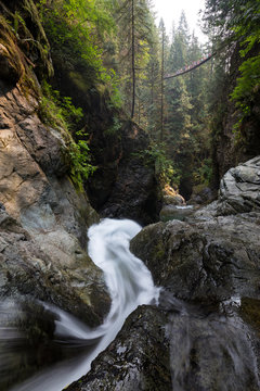 River flowing down the beautiful canyon in the Canadian Landscape. Taken in Lynn Valley, North Vancouver, British Columbia, Canada.