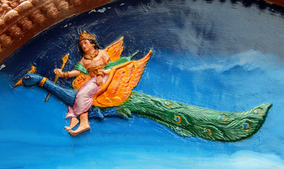 Wall art of Hindu God Kartikeya ride his mount peacock in a Temple  © reddees