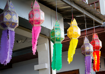 Colorful Northern Thai style lamps hanging outside the house