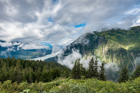 View down to ocean from mountain top over Juneau Alaska