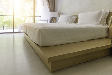 White bed with window light in modern style bedroom in perspective view