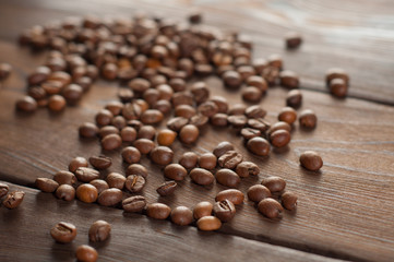 Coffee beans on a wooden background