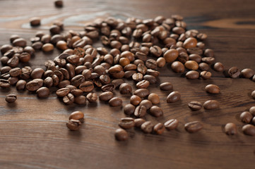 Coffee beans on a wooden background