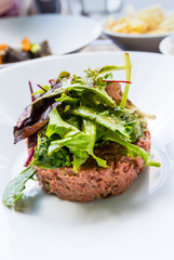 tasty Steak tartare (Raw beef) - classic steak tartare on white plate