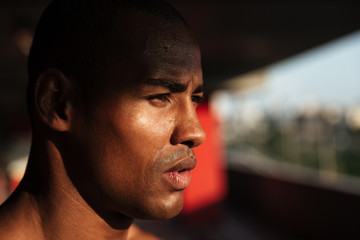 Close up portrait of a handsome african man looking away