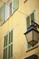Fototapeta na wymiar Yellow facade in a Street of Hyères - Provence