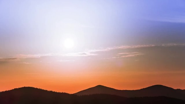 4K. Colorful sun  among mountain hills. Sunrise.Without birds, time lapse, RAW output