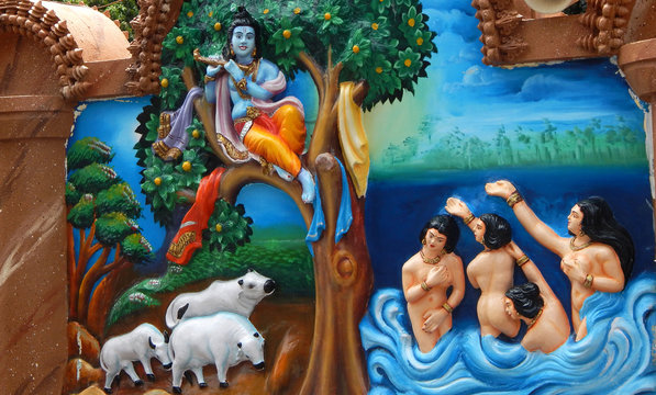 wall art of God Krishna steal clothes of Gopis bathing in Yamuna river naked to teach them a lesson in aTemple