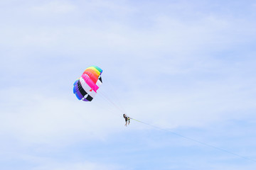 The sky parachute has a blue backdrop background.